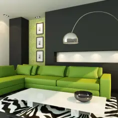 Nowoczesny salon z kanapą w intensywnym kolorze limonkowym, czarną ścianą i zieloną tapetą.